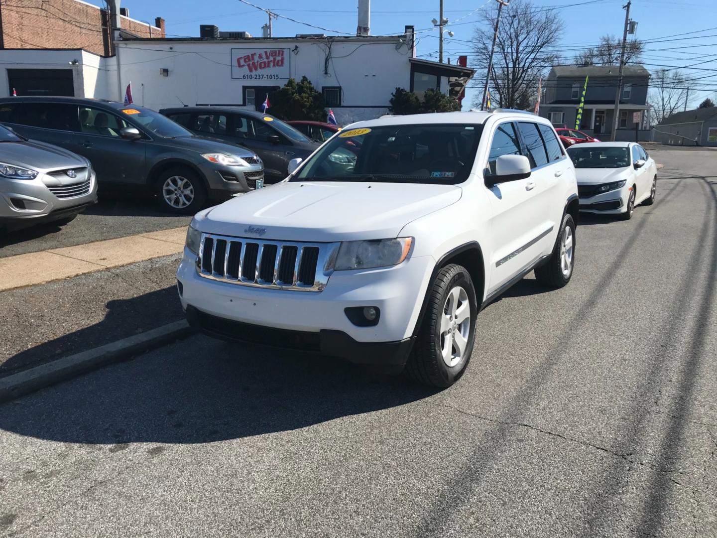 2013 White /Tan Jeep Grand Cherokee Laredo (1C4RJFAG6DC) with an 3.6 V6 engine, Automatic transmission, located at 577 Chester Pike, Prospect Park, PA, 19076, (610) 237-1015, 39.886154, -75.302338 - Photo#2